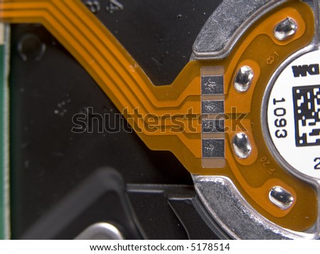 Contact pads on flexible circuit to control hard drive spindle