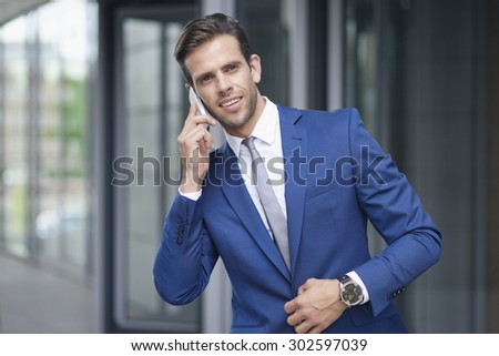 Handsome businessman is waiting outside the office