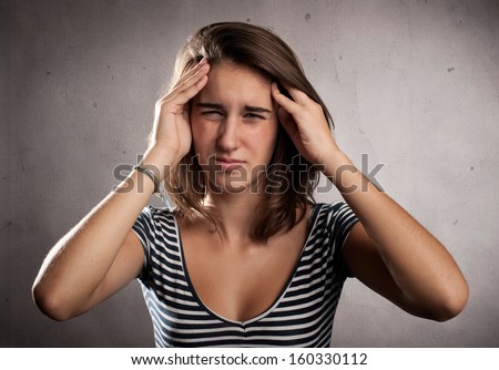 young woman having a headache