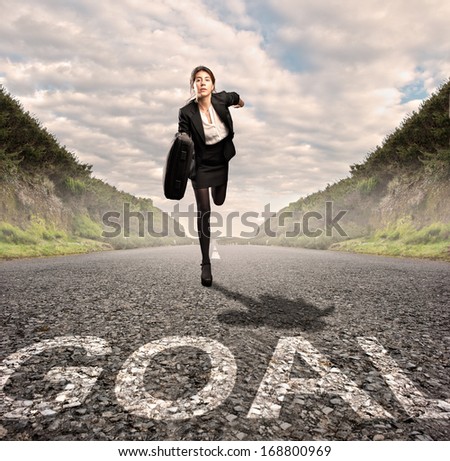 businesswoman on a road running. Motivation concept.