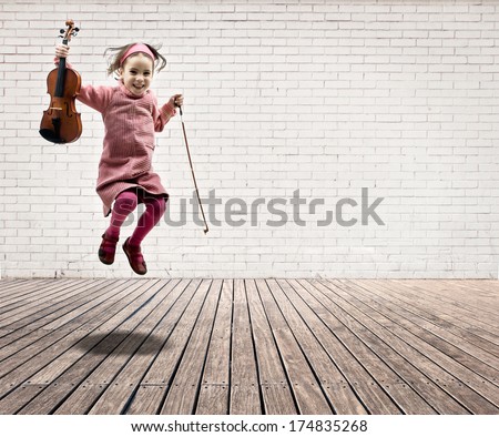 Little Girl With Violin Jumping On A Room With White Bricks Wall And Wood Floor
