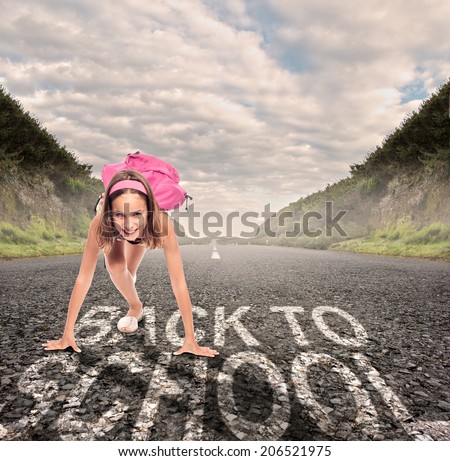 young girl on a road ready to run. back to school concept