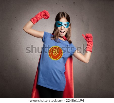 little girl wearing a superhero costume