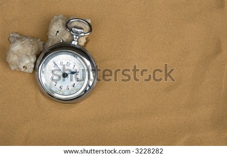 ancient watch in sahara desert sand background.