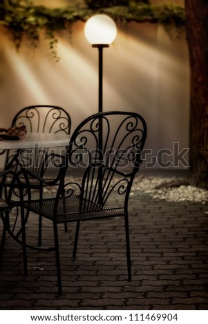 Dining table and chairs and the lamp in a restaurant
