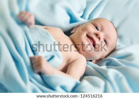 Newborn baby on blue blanket