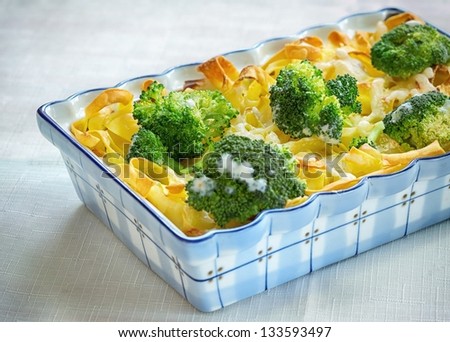 Tagliatelle pasta, broccoli and cheese sauce, and oven baked, a healthy, hearty vegetarian meal.