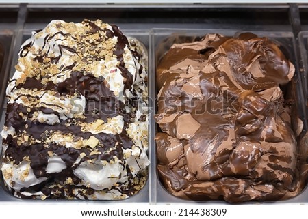 Variety of yummy ice creams under shopping window