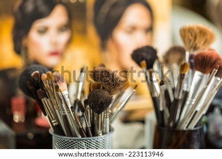 Close up view of different cosmetic brushes for makeup on a dressing table