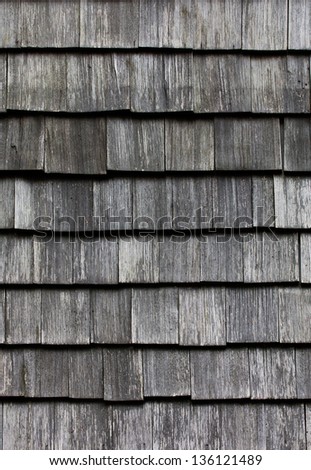 Wooden tile on the roof of a house