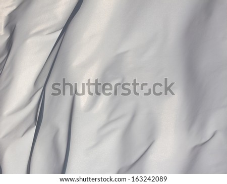 White fabric in the wind in the sunlight