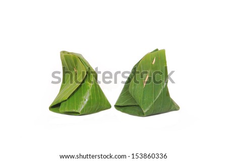 Thai dessert ,sticky rice with steamed  ,wrapped in banana leaves.