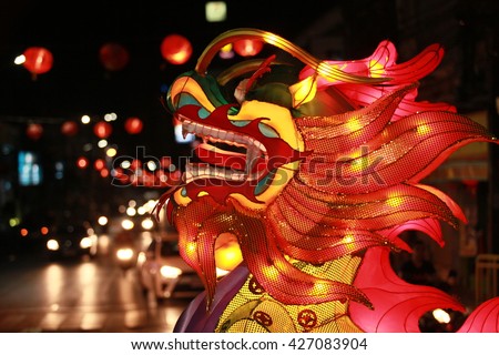 Chinese new year silk dragon in night street view background.