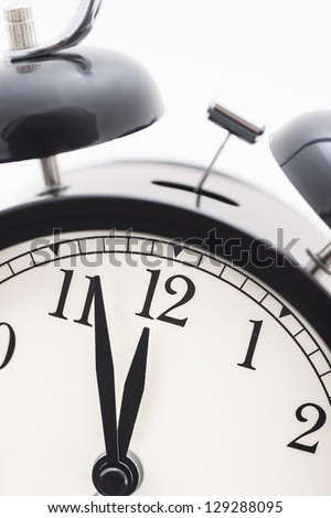 Old fashioned alarm clock almost at twelve o\'clock