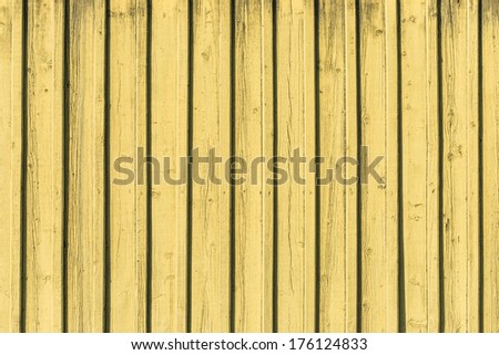 Seamless empty space background of vintage textured yellow wooden wall with rough weathered surface