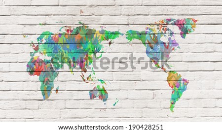 Map of the world with the people of earth represented by hands in different colors. Conceptual image of population, global friendship and teamwork.