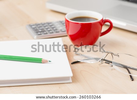 Office equipment at workplace. Desktop with laptop. Conceptual image of desk work, communication technology and business.