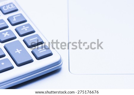 Calculator and pencil. Office equipment at workplace. Conceptual image of desk work, financial paperwork and business economy.
