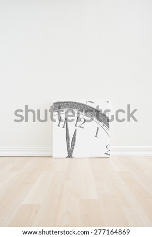 Empty room interior with artwork picture frame standing on wooden floor. Bright white scandinavian design and clean contemporary architecture. Conceptual image of moving to a new home or apartment.