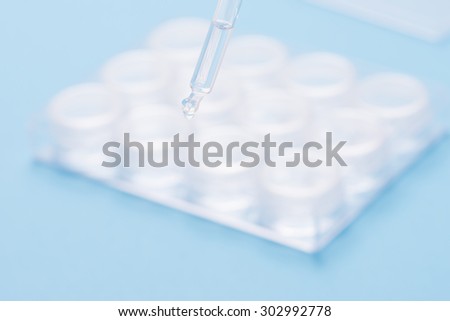 Lab research with fluids. Conceptual image of clinical testing, scientific analysis and health science.