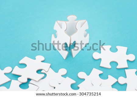 Three puzzle pieces. Conceptual image of connection, teamwork and business strategy.