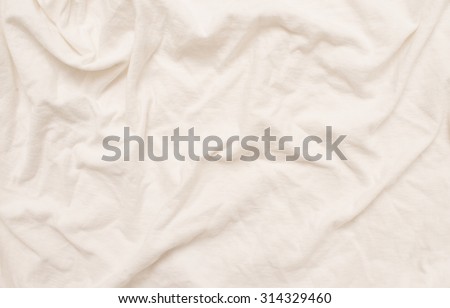 Empty crumpled white bed sheet.