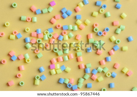 Multitude of plastic beads with different colors