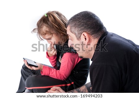 child teaches to adult how to speak a mobile