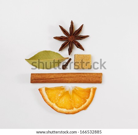 Mulled wine / punch / tea condiments arranged in a creative shape of a smiling face