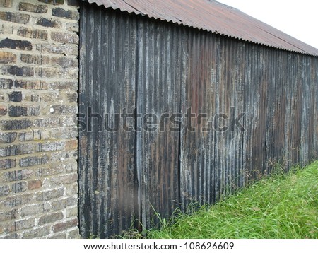 Old brick next to tin sheet building