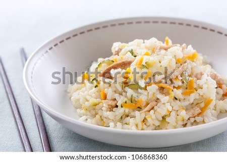 Rice sauteed with zucchini, onion, carrot and chicken