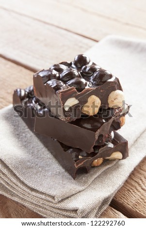 Delicious chocolate with hazelnuts on canvas