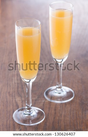 Bellini cocktail prepared in the traditional way on wooden table