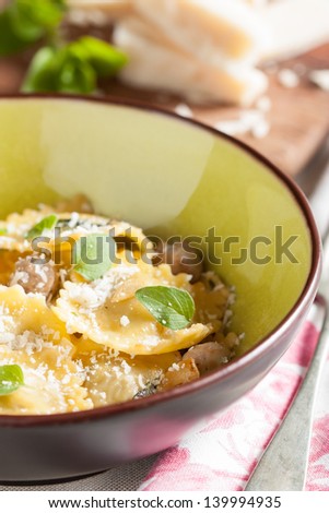 Modern yet rustic table set with a dish of meat and cheese ravioli