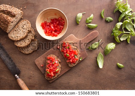Italian bruschetta on wooden table overview