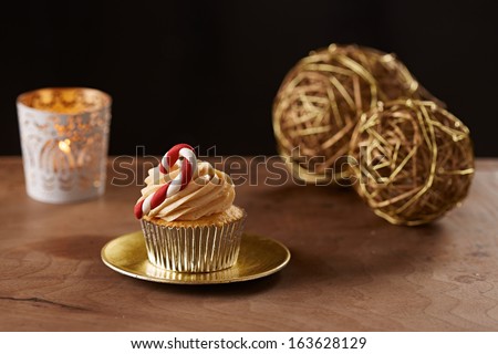 Candy bar cupcake on black Christmas background
