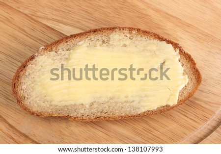 rye bread and butter on wooden board