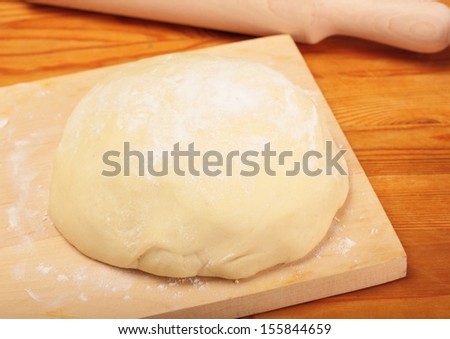 Baking. Bread cooking. dough on  wooden table
