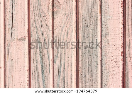 Old wooden painted pink rustic background, paint peeling