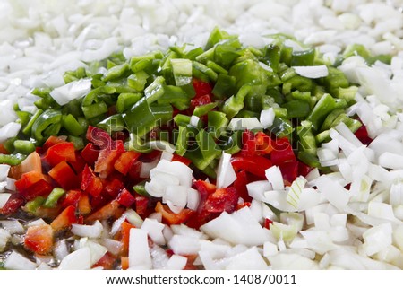 onions, red and green peppers diced prepared for cooking