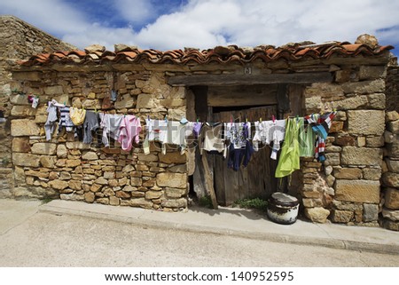 wash clothes drying in the sun in a village with stone houses in Spain