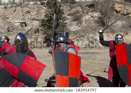 TERUEL, SPAIN - FEBRUARY 22 2014: Participants during the representation of a medieval battle taking place within the party The Marriage of Isabel de Segura in Teruel every month in February.