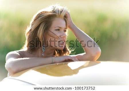 Portrait of a cute blonde enjoying the sun and nature