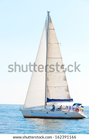 Racing yacht in the Mediterranean sea on blue sky background