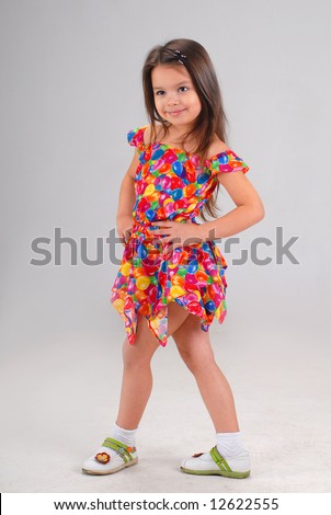 Baby Girl Fancy Dress on Little Cute Brown Haired Baby Girl Posing In Fancy Colored Short Dress