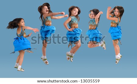 little cute girl in bright blue dress jumping with excitement