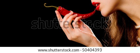 Profile girl holding her mouth red chili peppers
