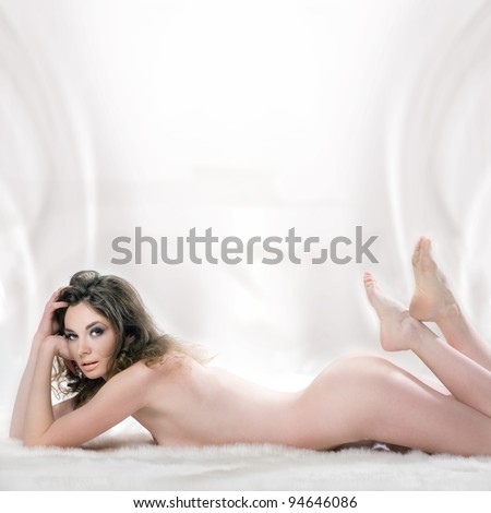 stock photo Portrait of naked woman lying with perfect body line in the 