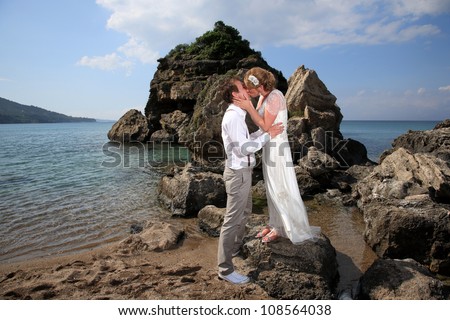 portrait of a bride and groom on the beach