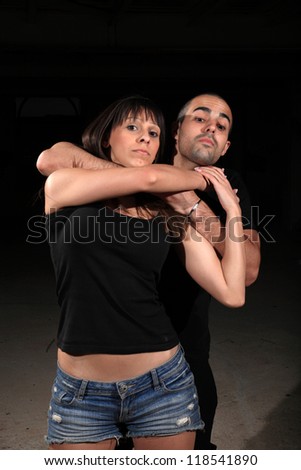 martial arts female instructor exercising with young man